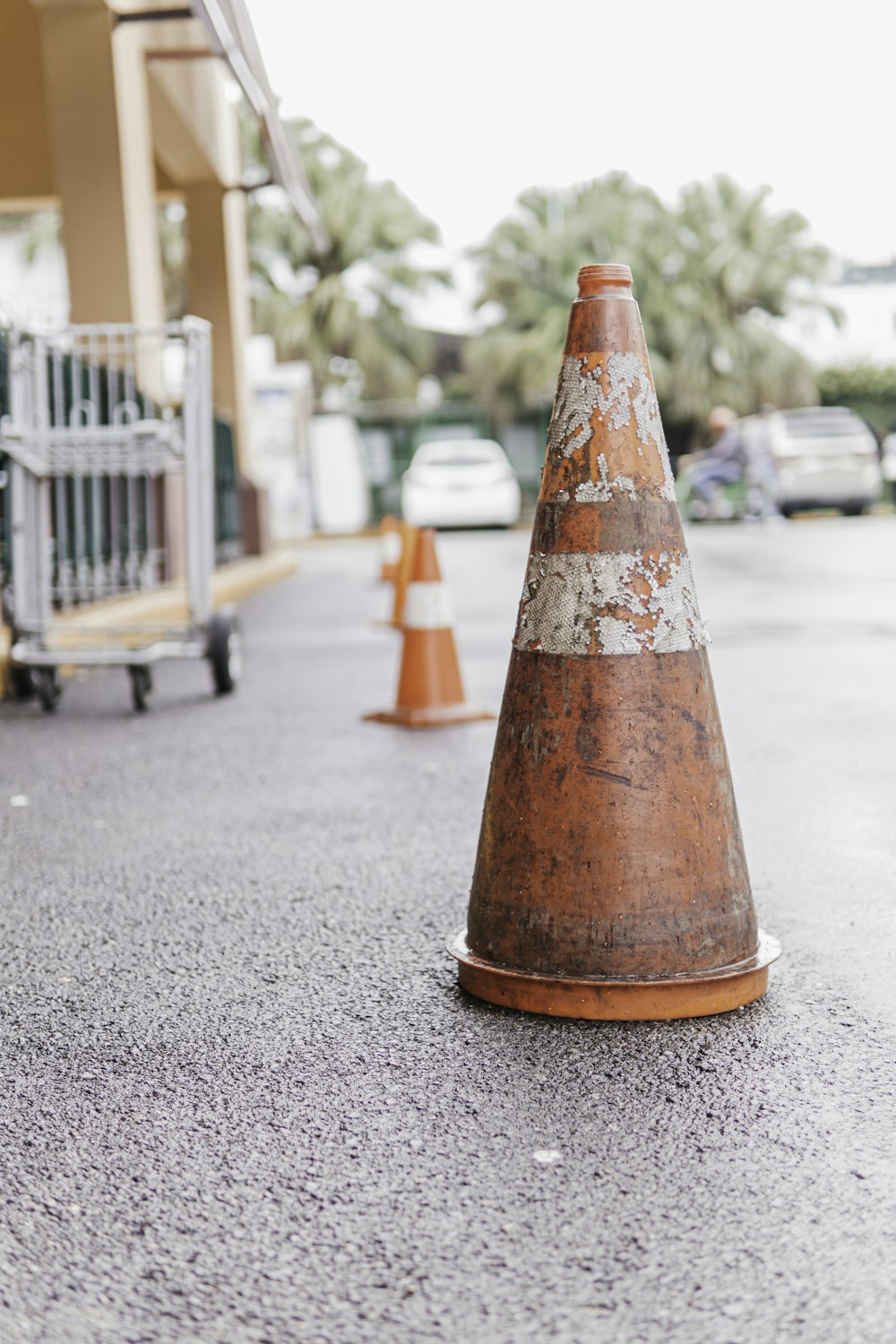 a traffic cone sitting on the side of a road