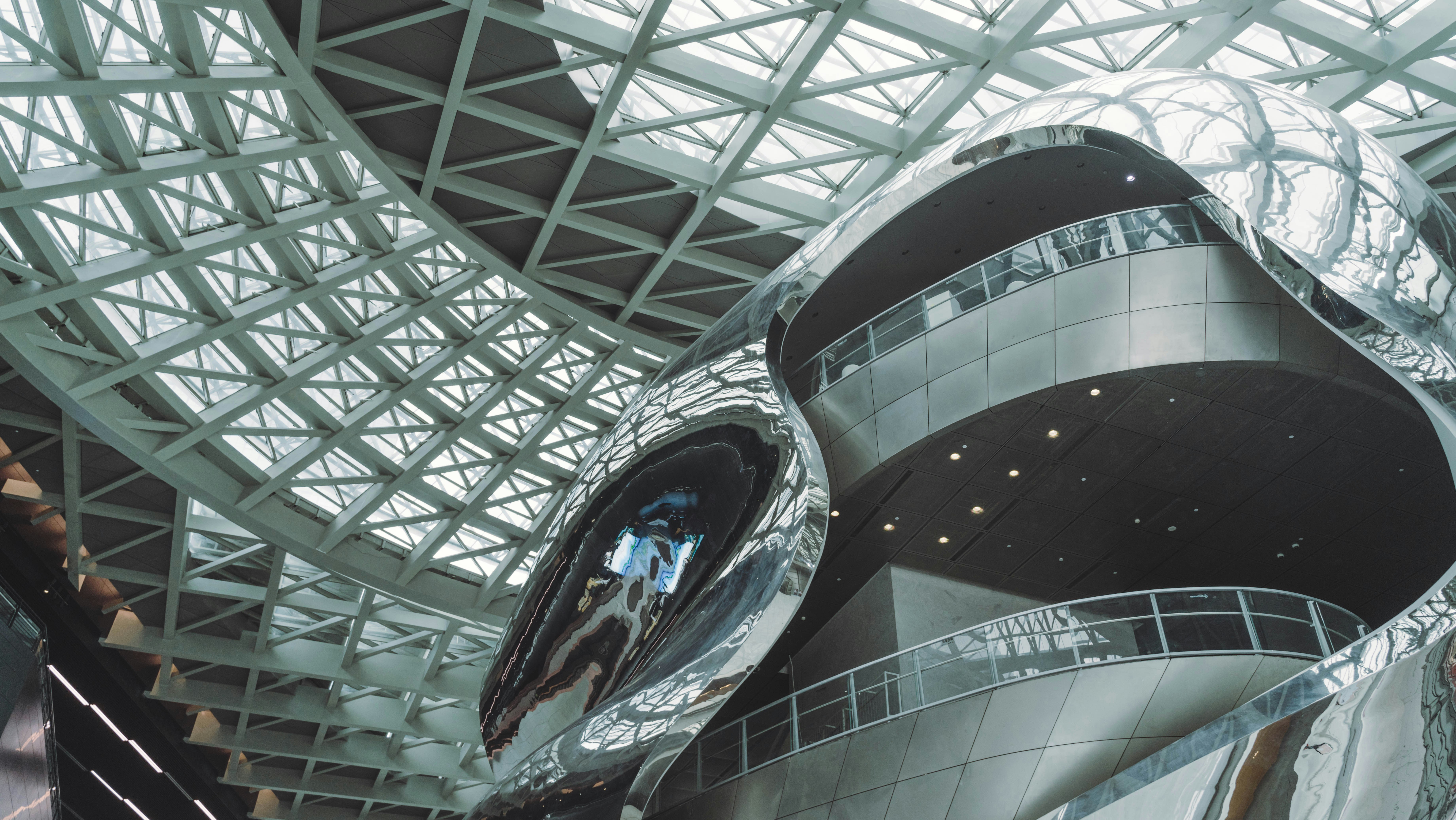 a large metal structure with a glass roof