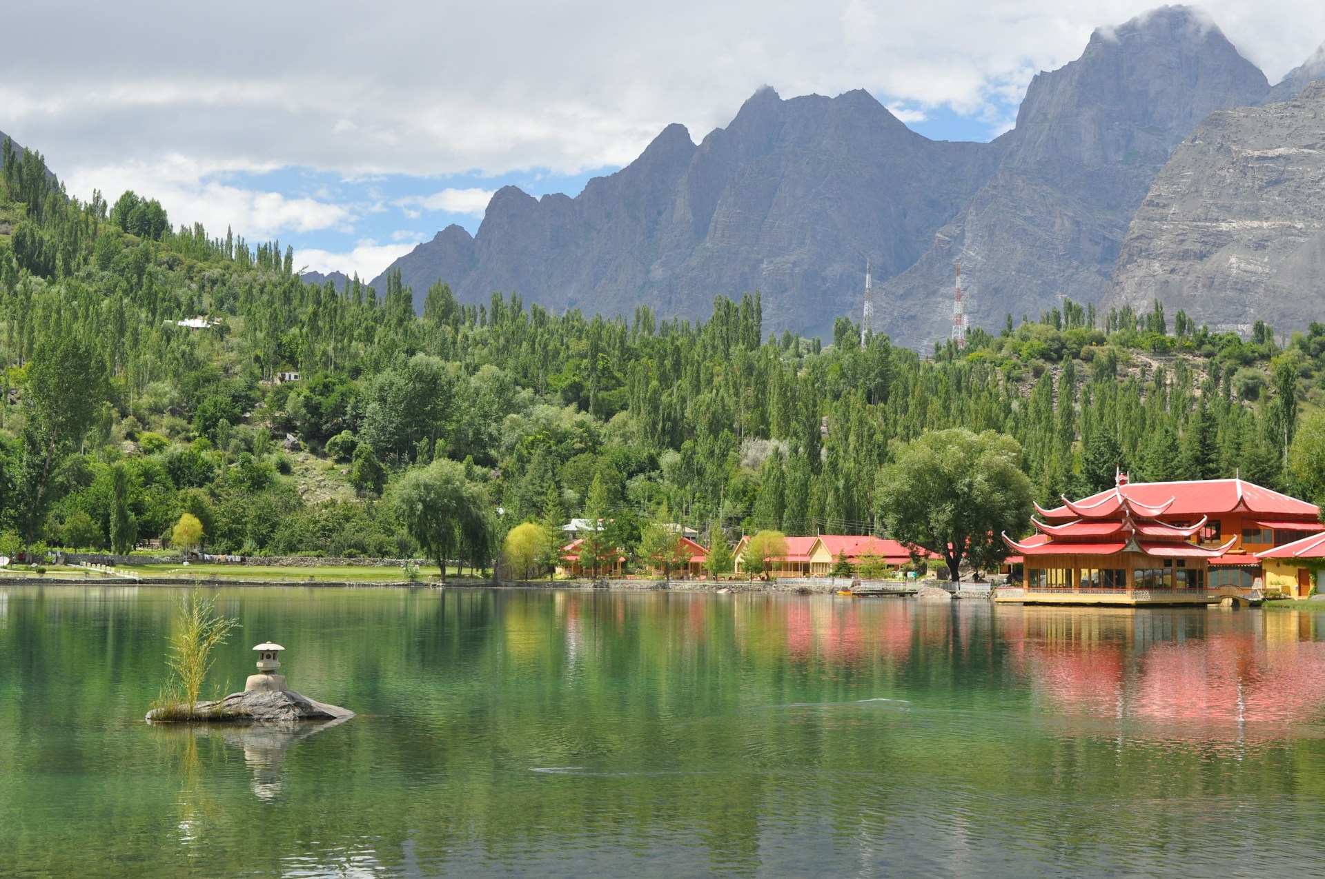 a body of water surrounded by mountains and trees