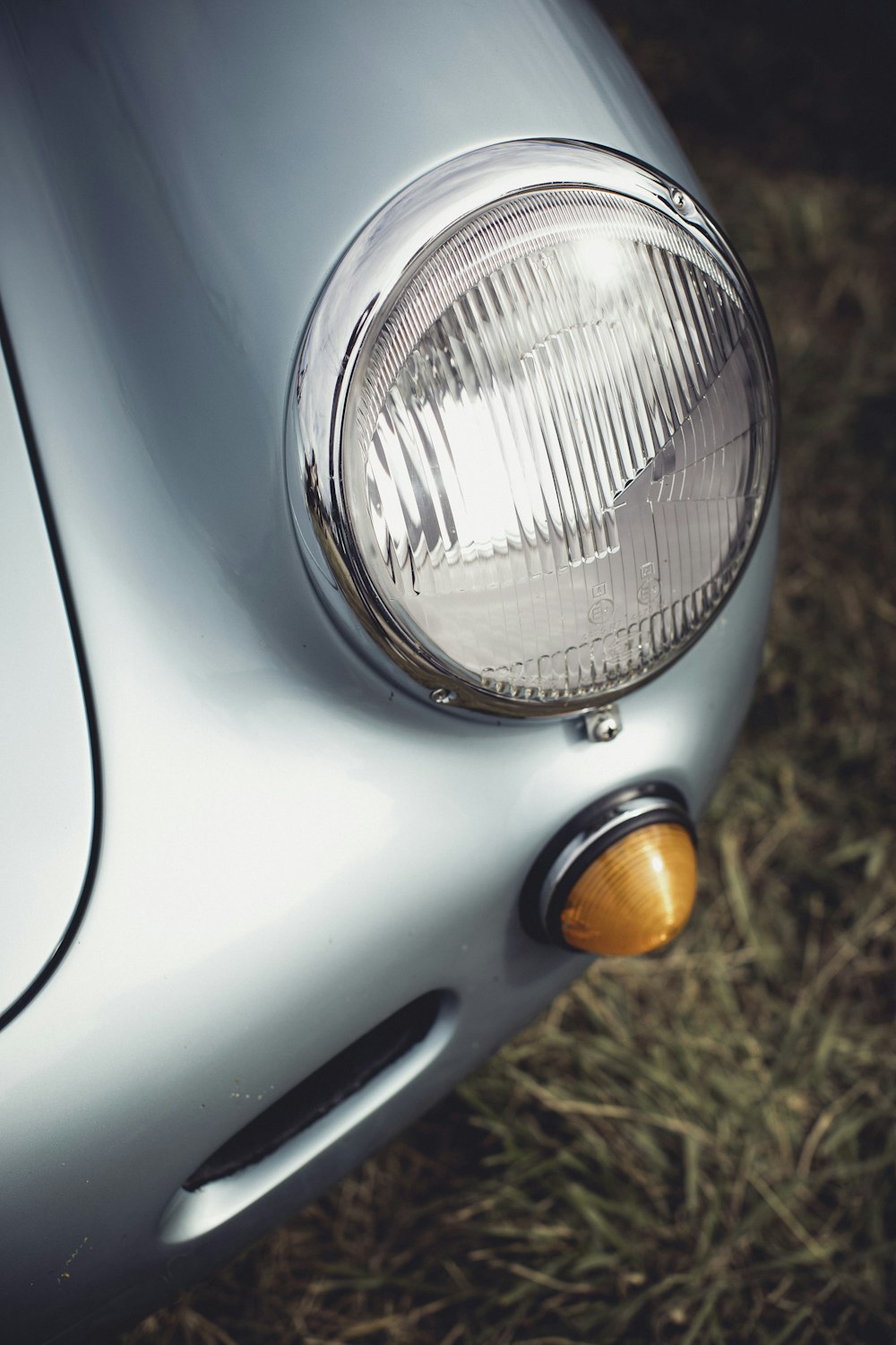 a close up of a headlight on a car