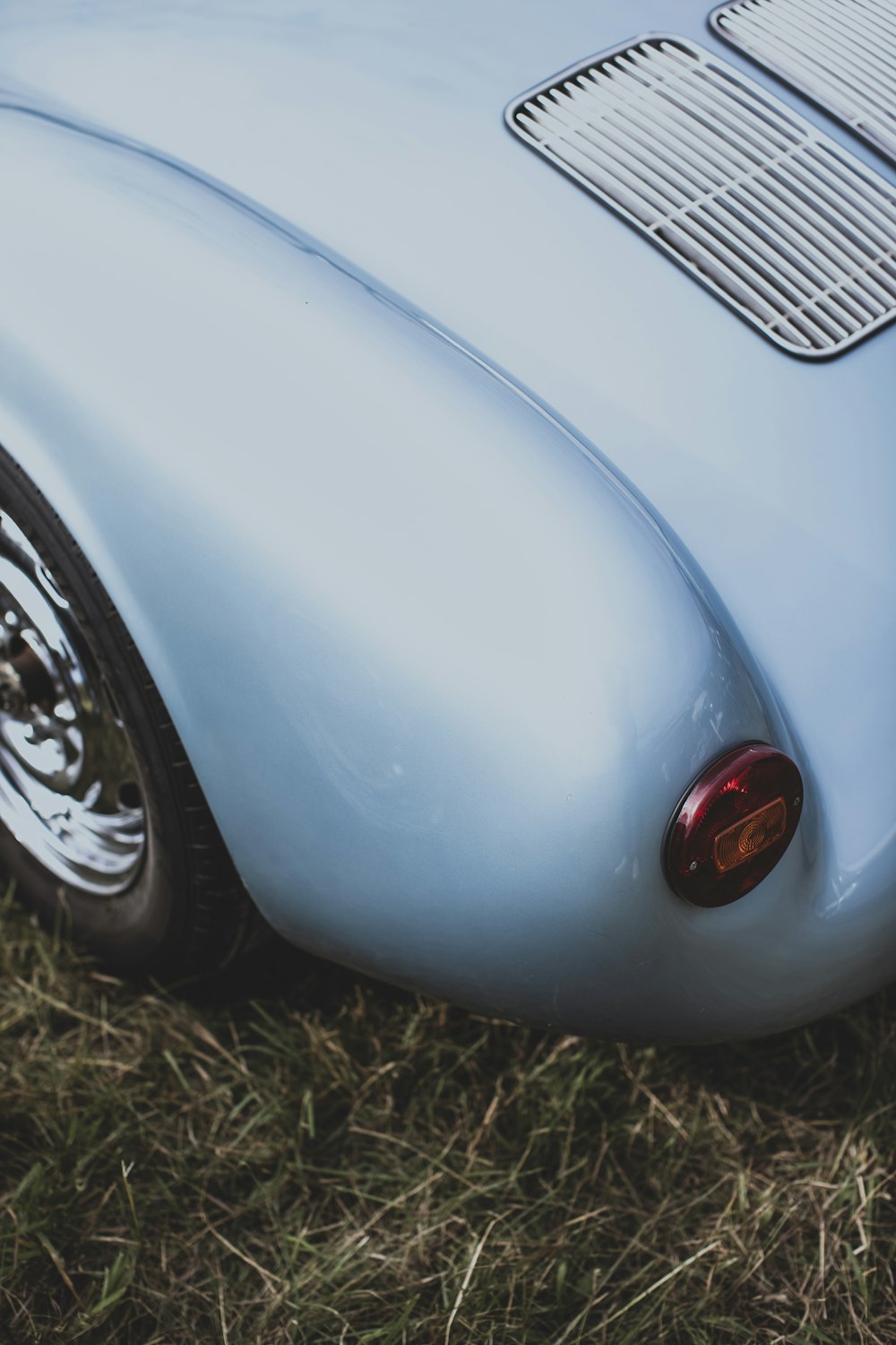 a close up of a car parked in a field