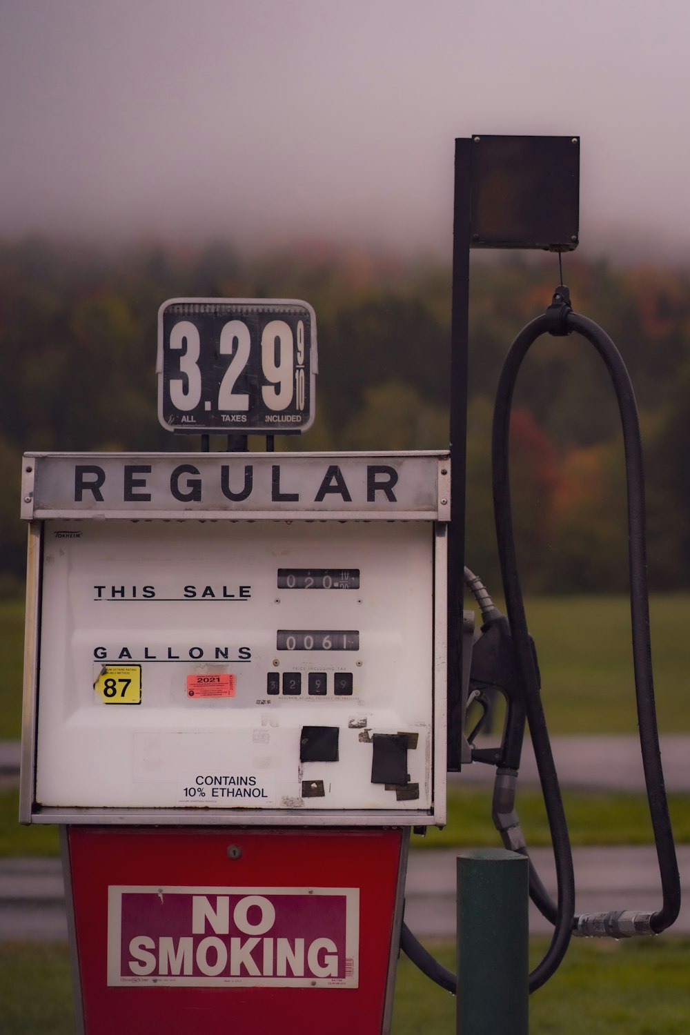 a gas pump with a no smoking sign on it