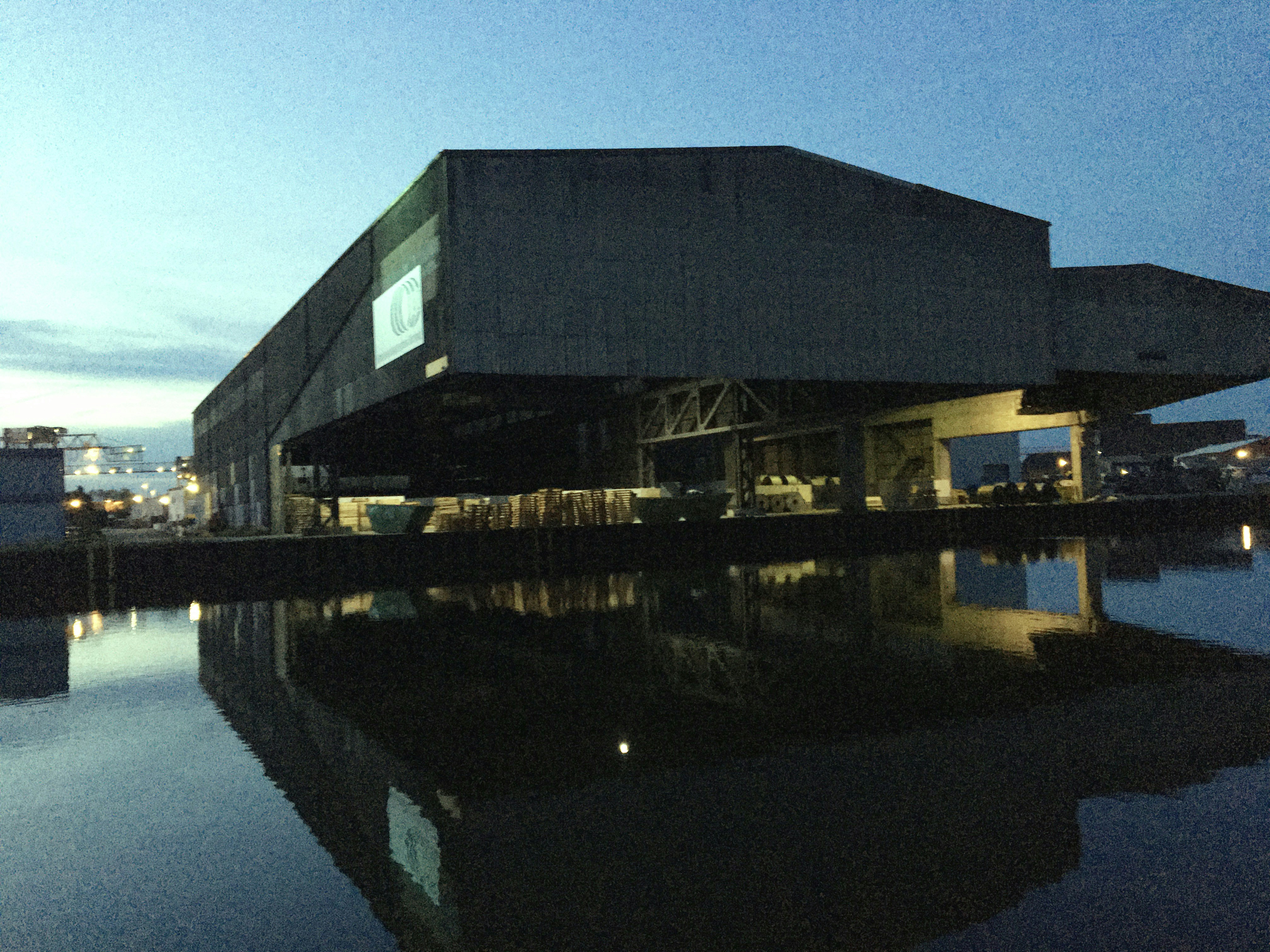 a large building sitting next to a body of water