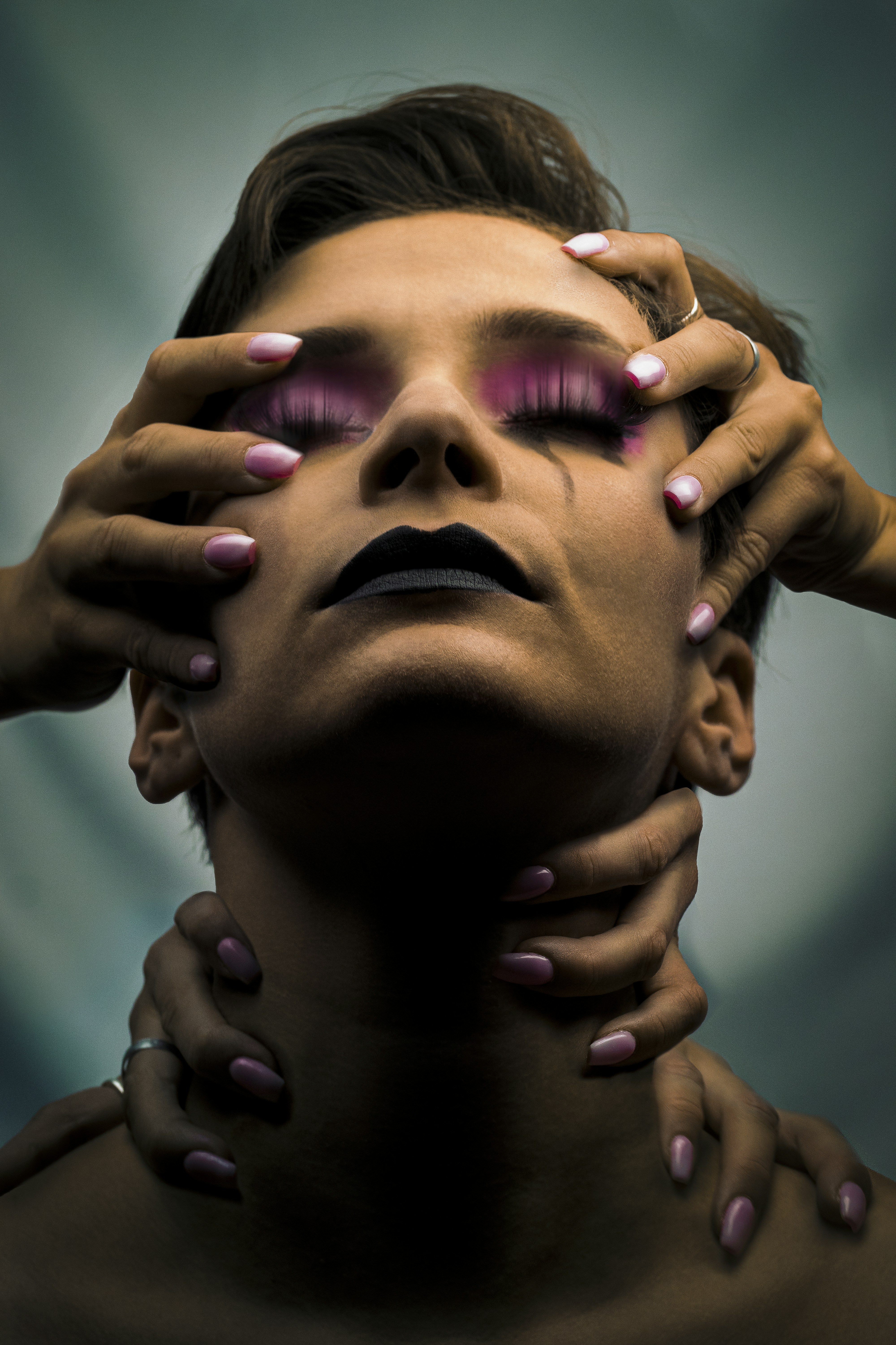 a woman with her hands on her face