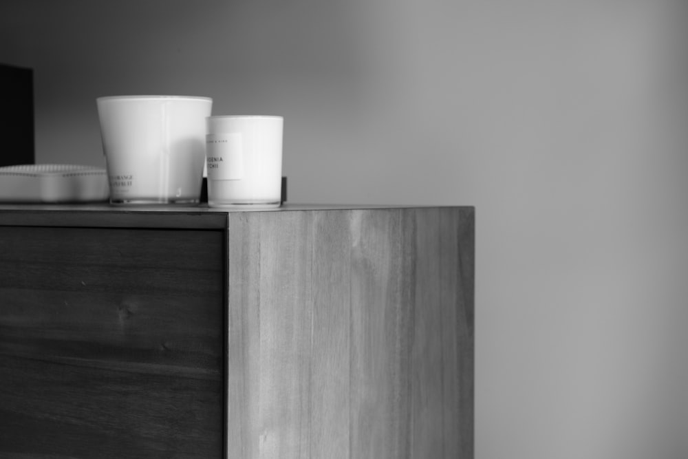 a vase sitting on top of a wooden table