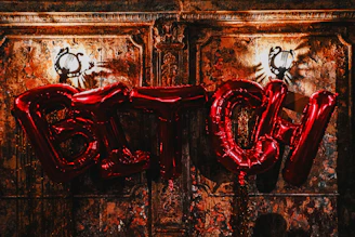 Metal letter wall hanging spelling out a cozy word in brushed gold finish