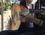 a man is playing a musical instrument outside