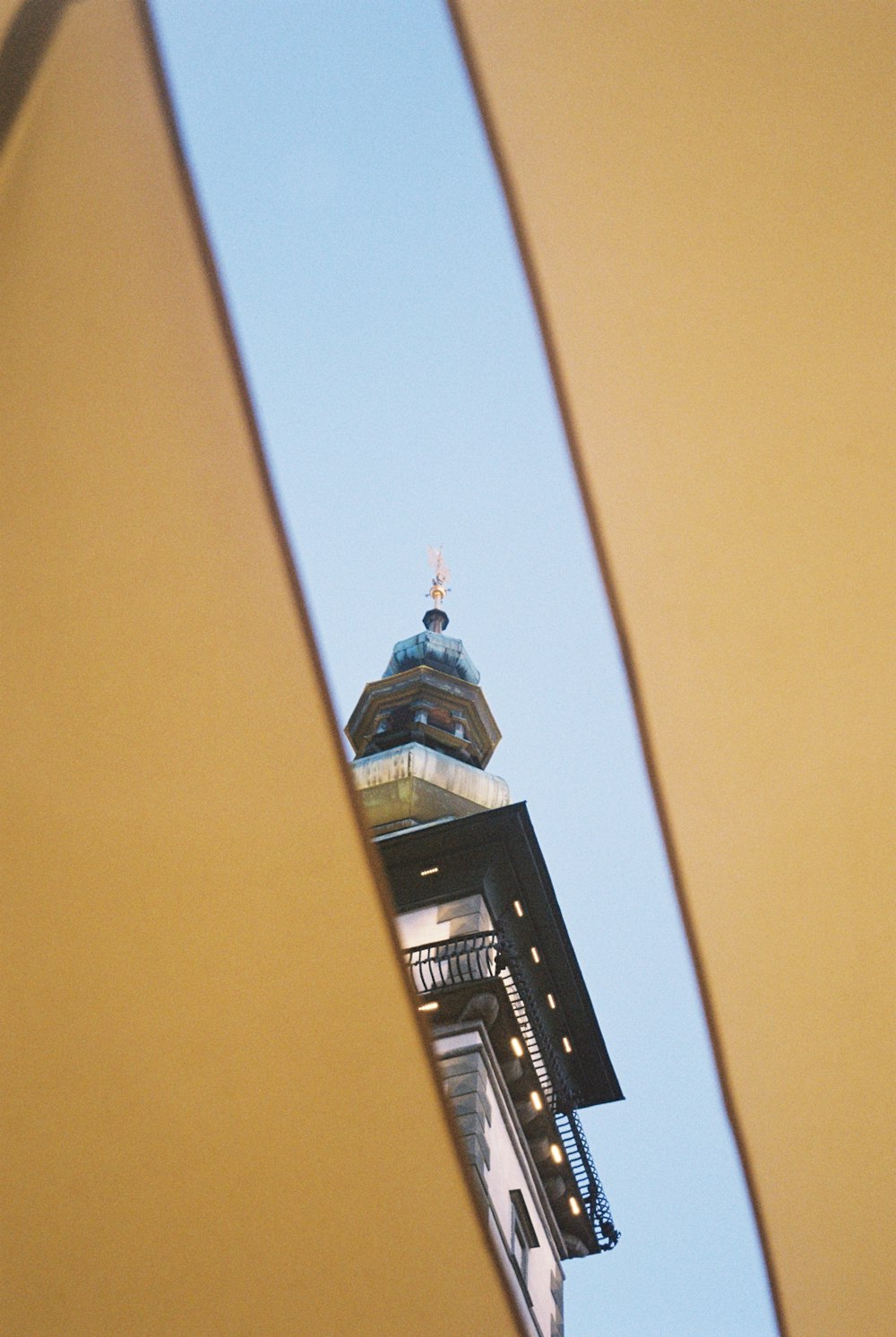 a tall building with a clock on the top of it