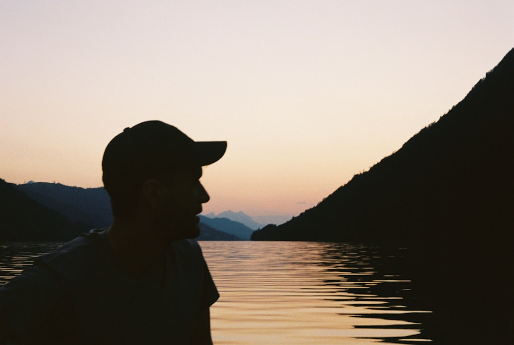 a man sitting on a boat in the water