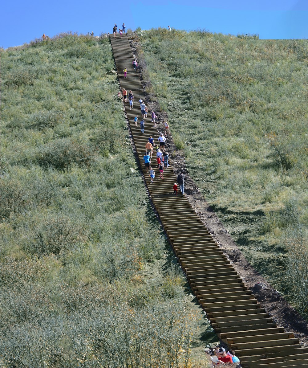 a group of people walking up a long train track