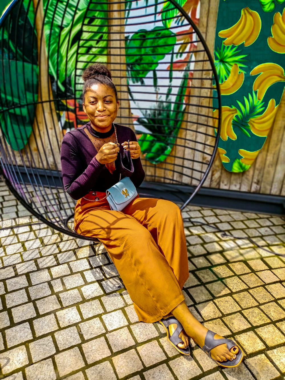 a woman sitting in a chair with a book in her hand