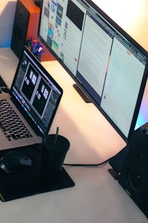a laptop computer sitting on top of a desk