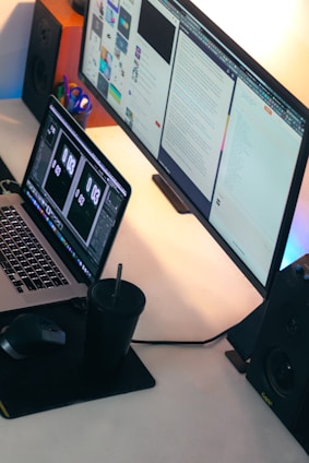 a laptop computer sitting on top of a desk