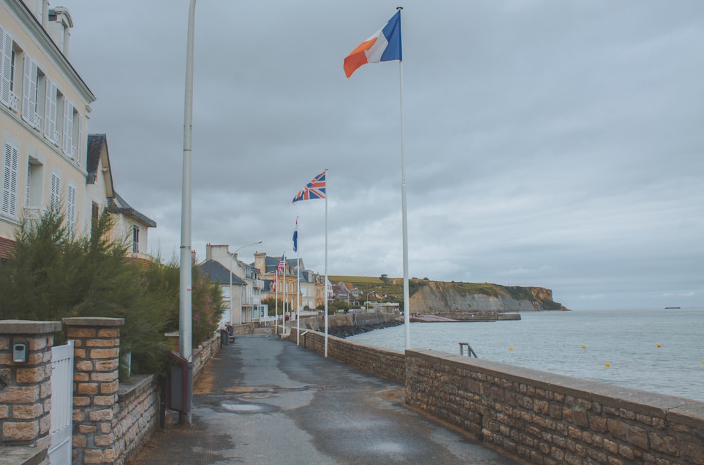 a street with flags on a cloudy day