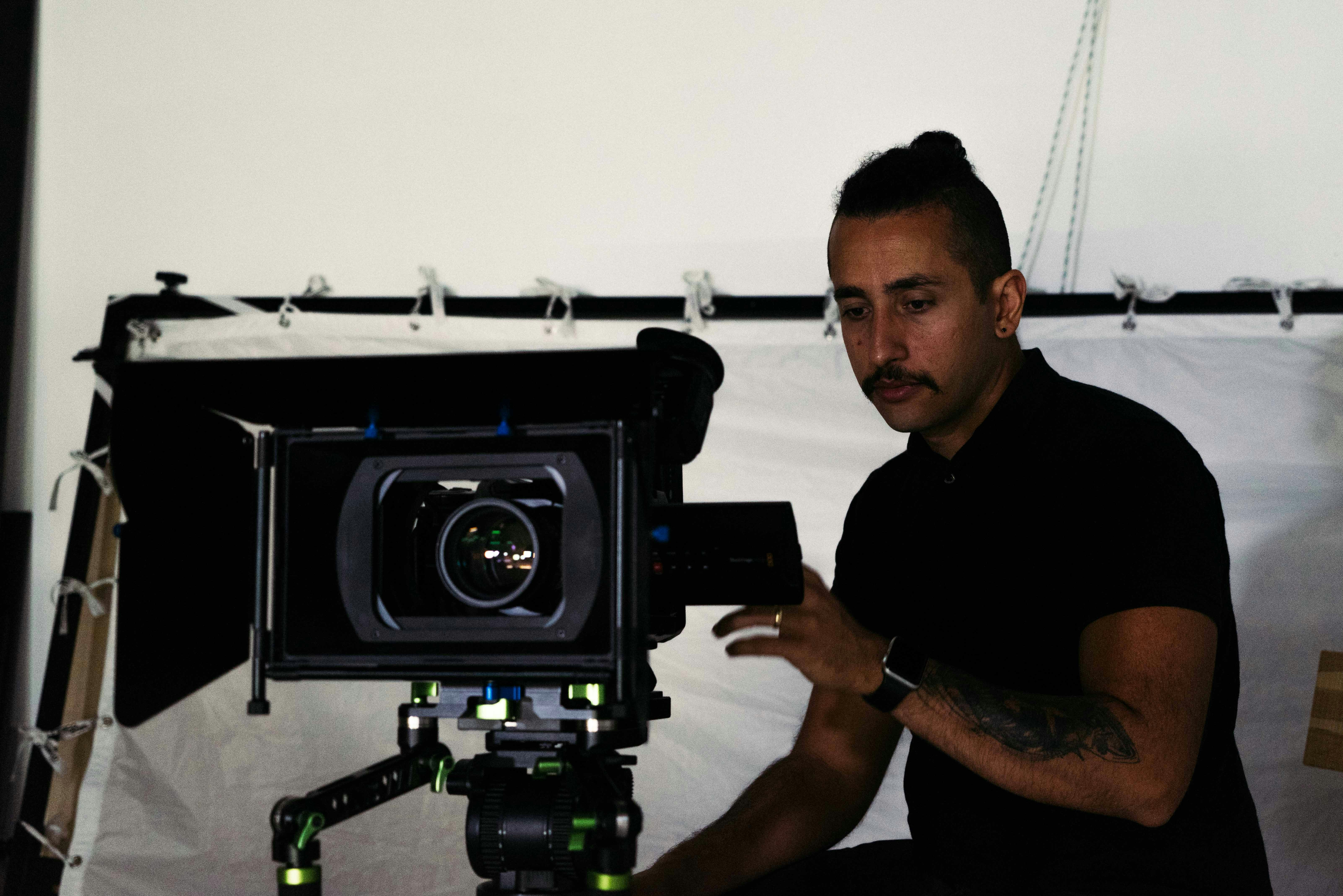 a man sitting in front of a camera