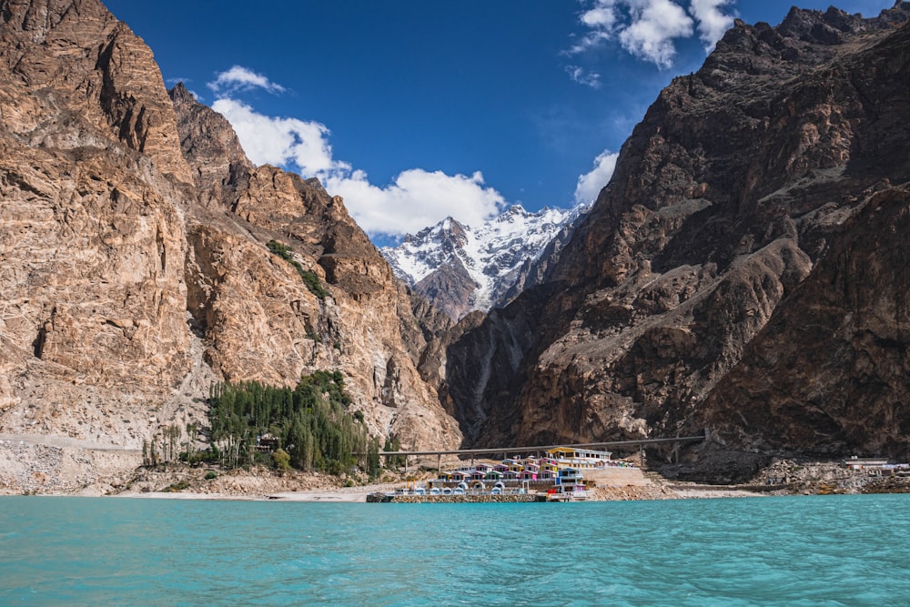 a body of water with mountains in the background