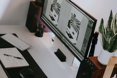 a computer monitor sitting on top of a desk