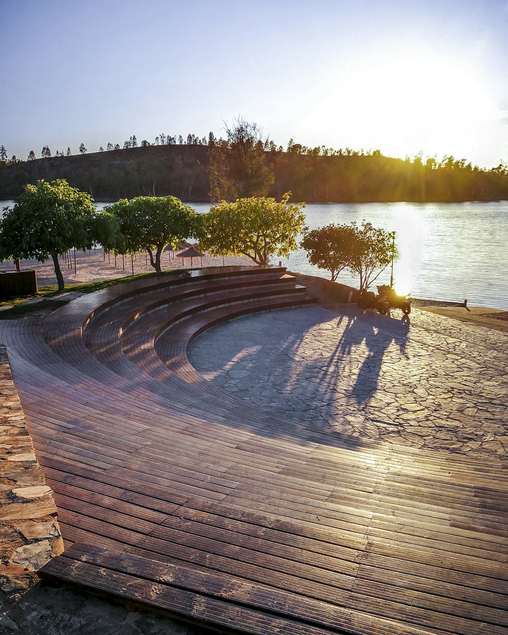 a wooden deck with a view of a body of water