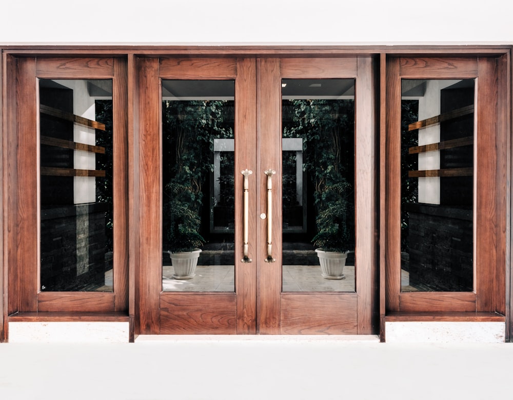 a close up of a wooden door with glass