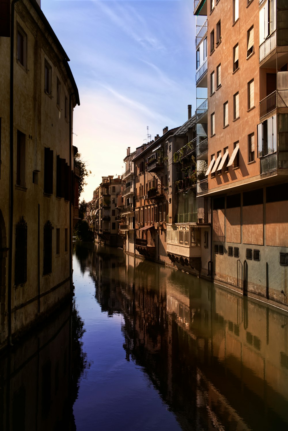 a river running through a city next to tall buildings