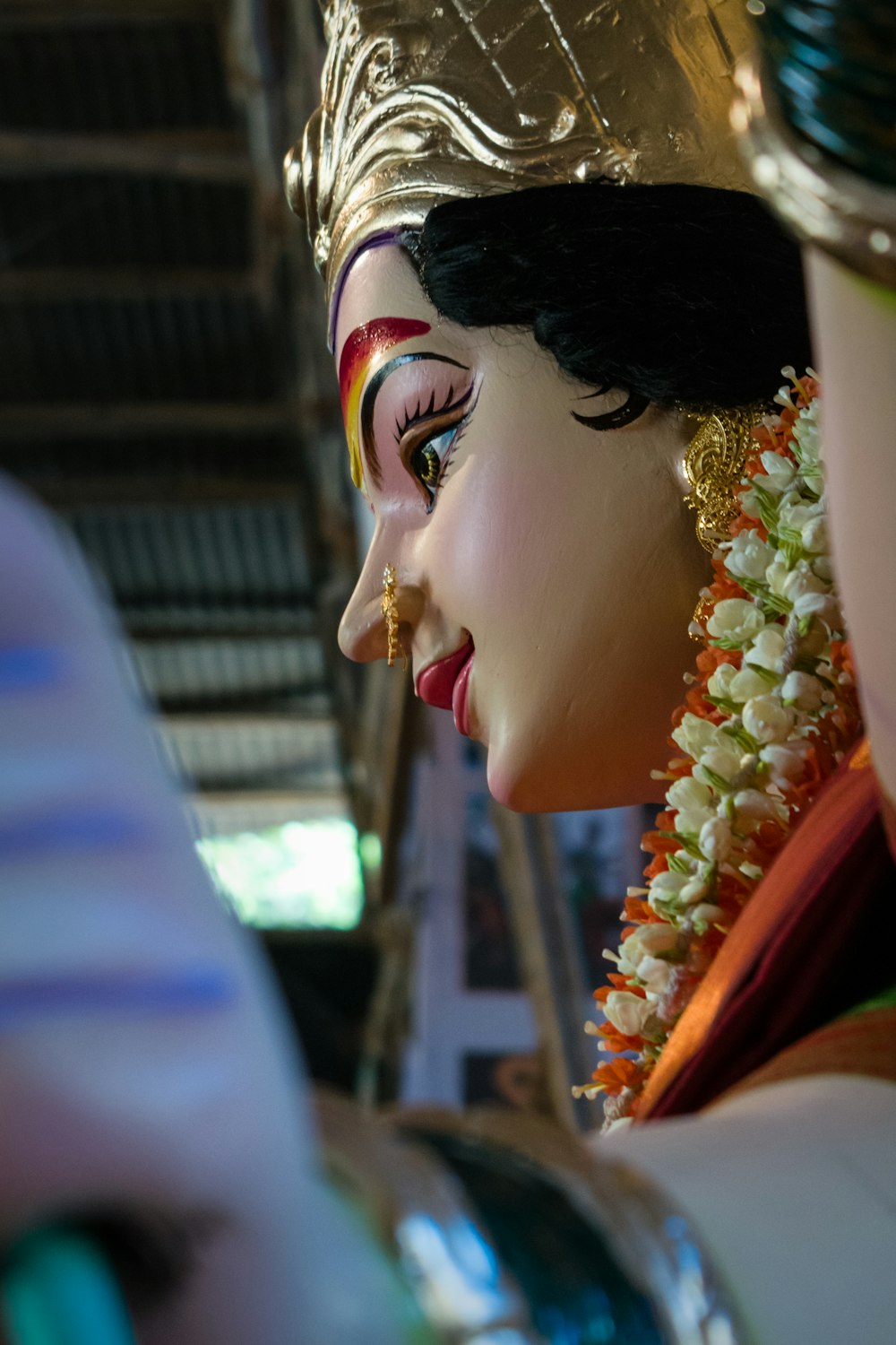 a close up of a statue of a person wearing a headdress