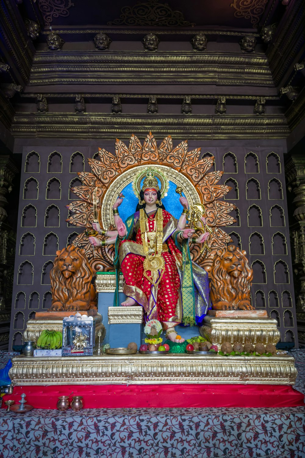 a statue of a person sitting on a throne