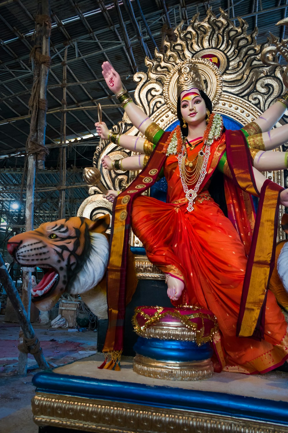 a statue of a woman sitting on top of a tiger