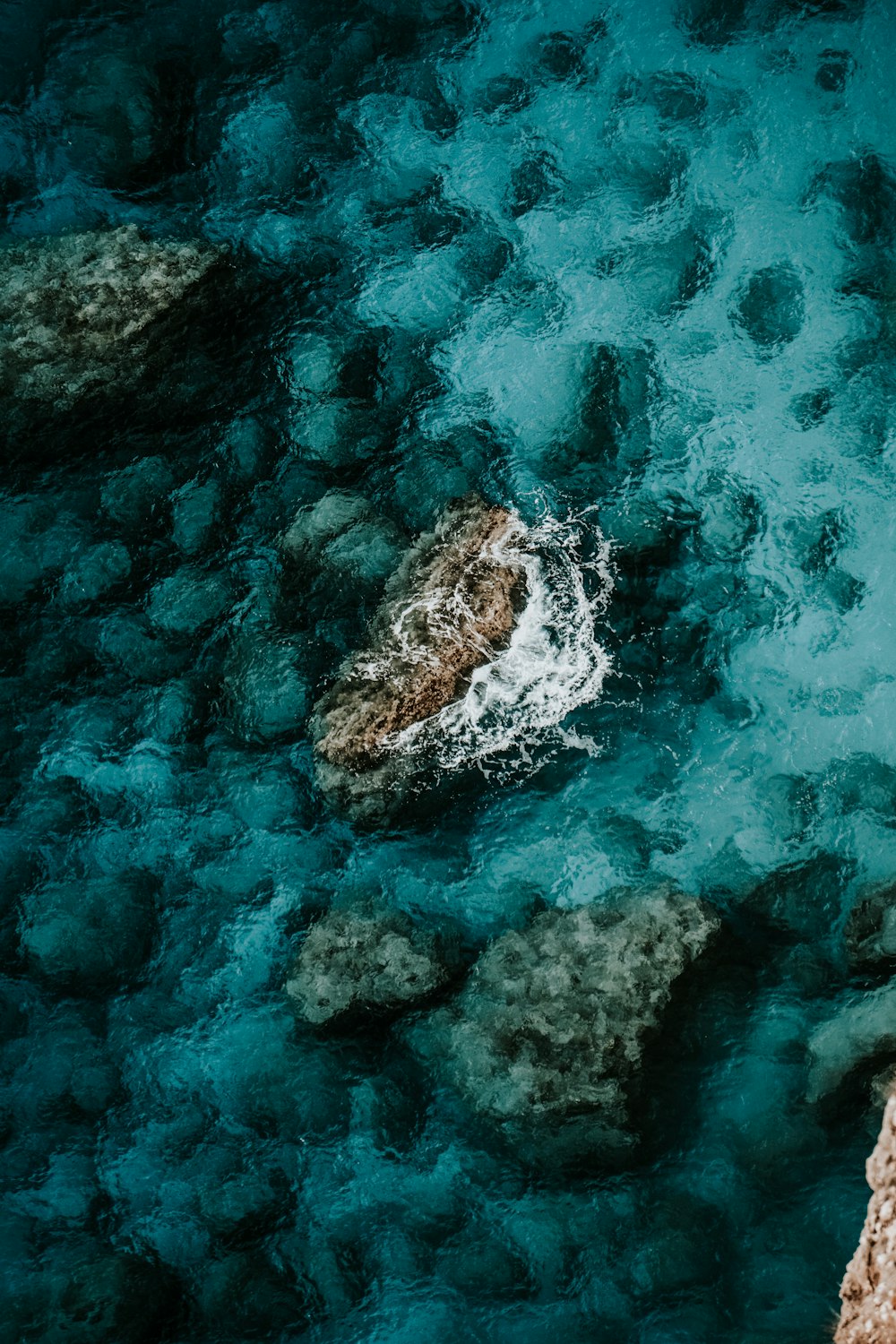 a body of water that has some rocks in it