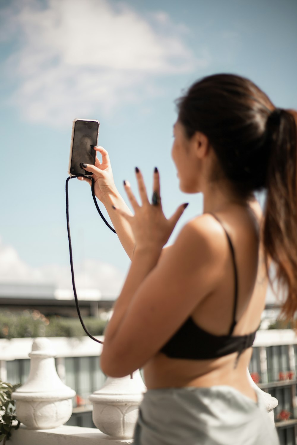 a woman taking a picture with her cell phone