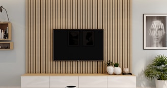 a living room with a flat screen tv mounted on a wall