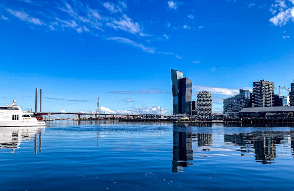 a boat is in the water near a city