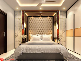 a bedroom with a bed and a ceiling fan
