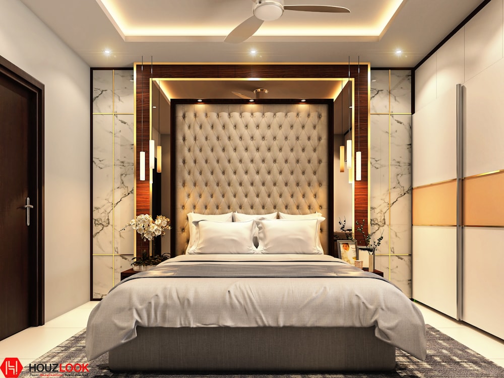 a bedroom with a bed and a ceiling fan