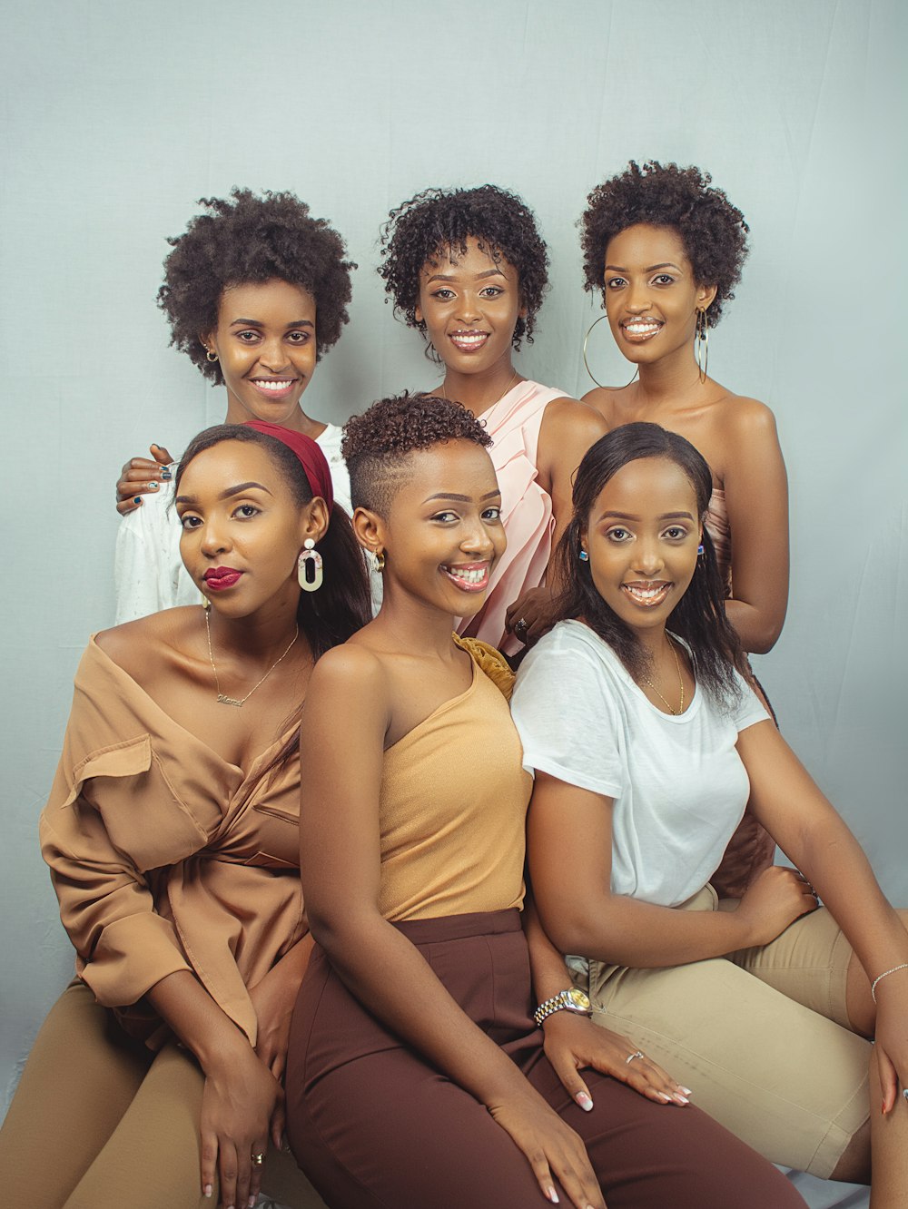 a group of women sitting next to each other