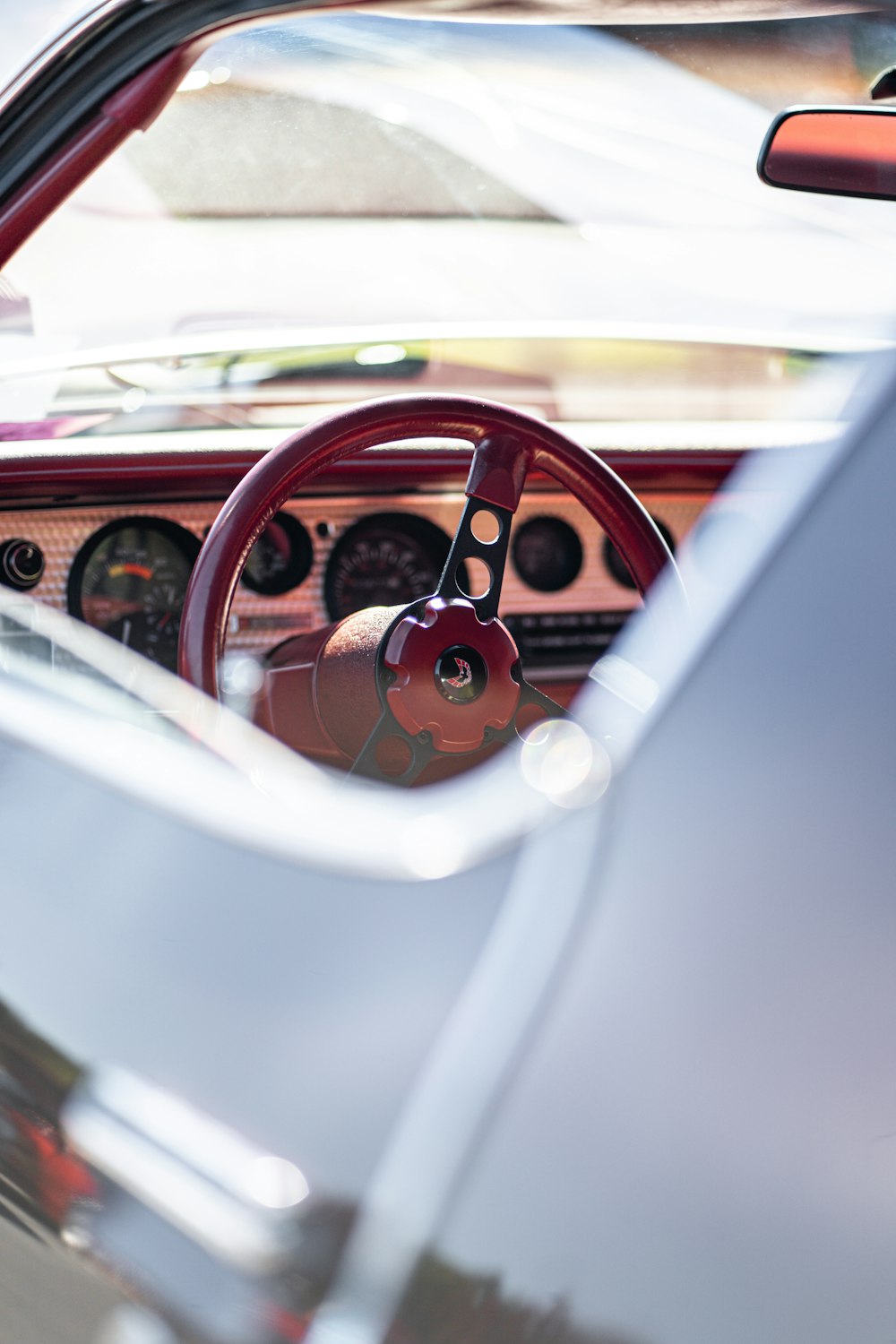 the interior of a car with a steering wheel and dashboard