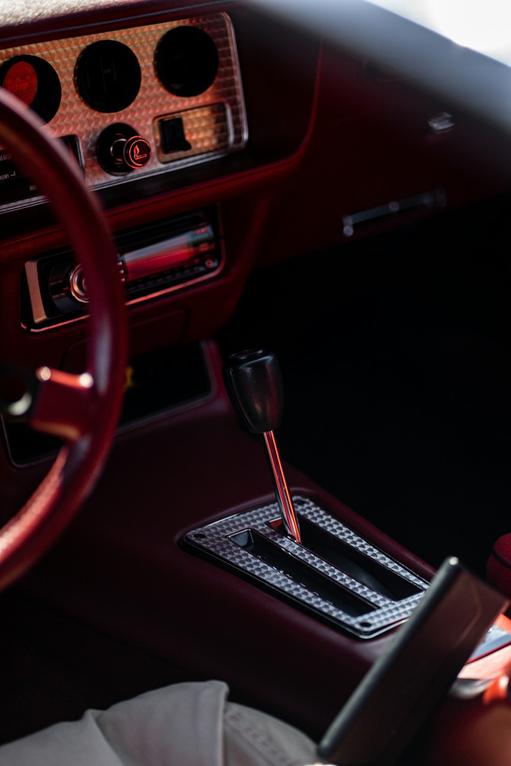 the interior of a car with a steering wheel and dashboard