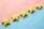 a row of yellow stars sitting on top of a blue and pink surface