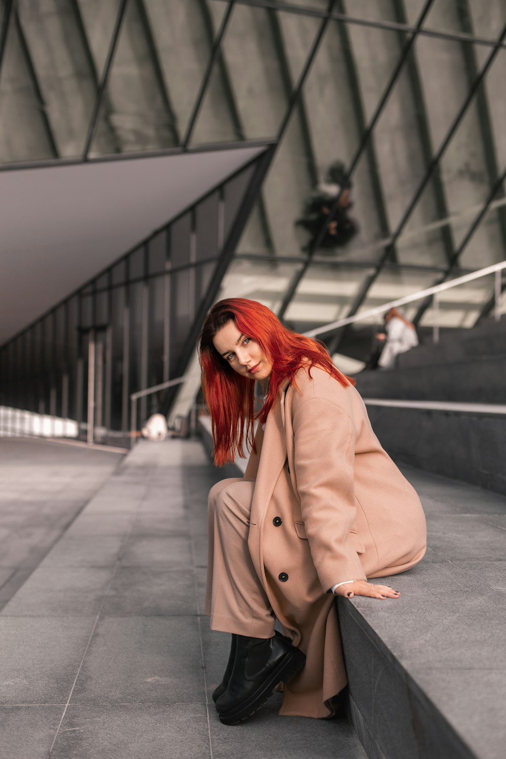 a person sitting at a train station