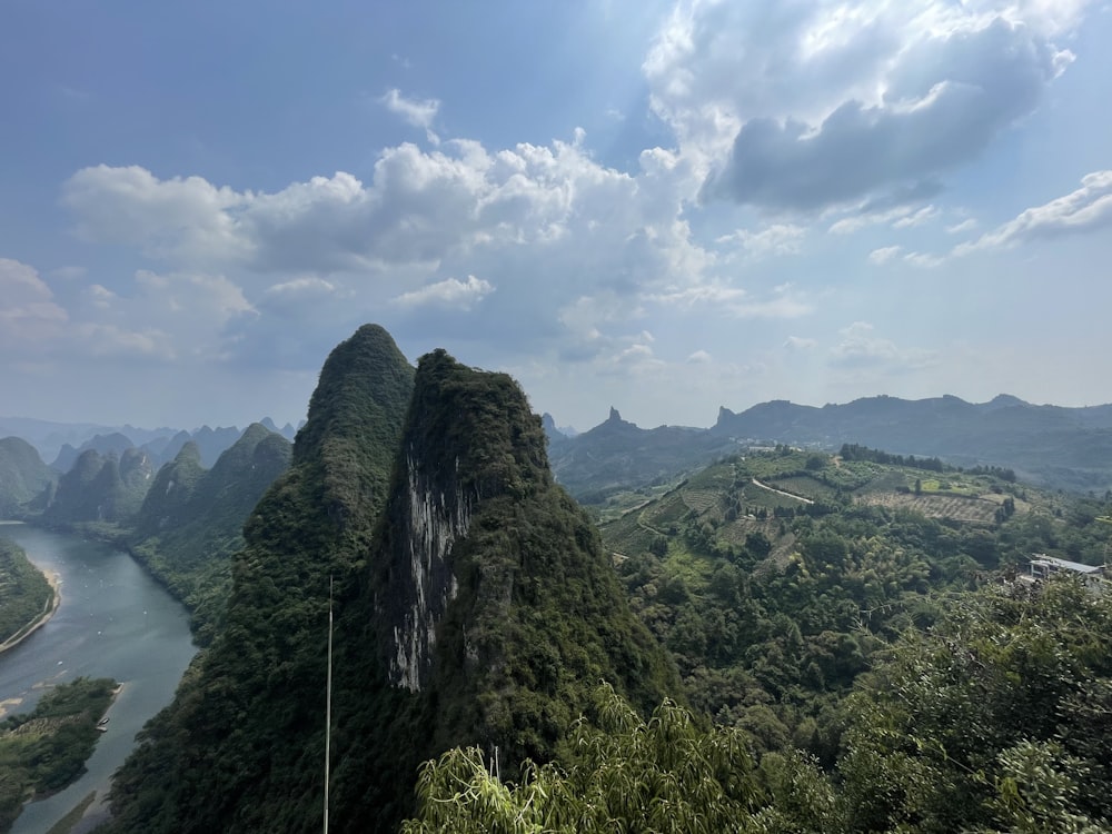 a scenic view of a river and mountains