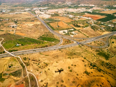 an aerial view of a highway intersection in the desert