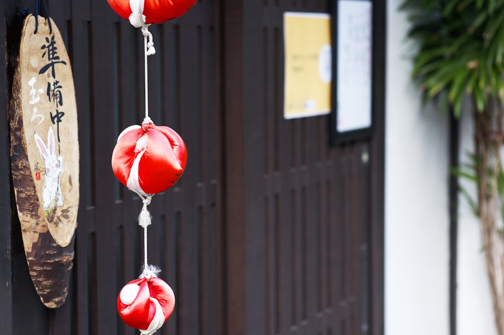 a bunch of red boxing gloves hanging from a hook
