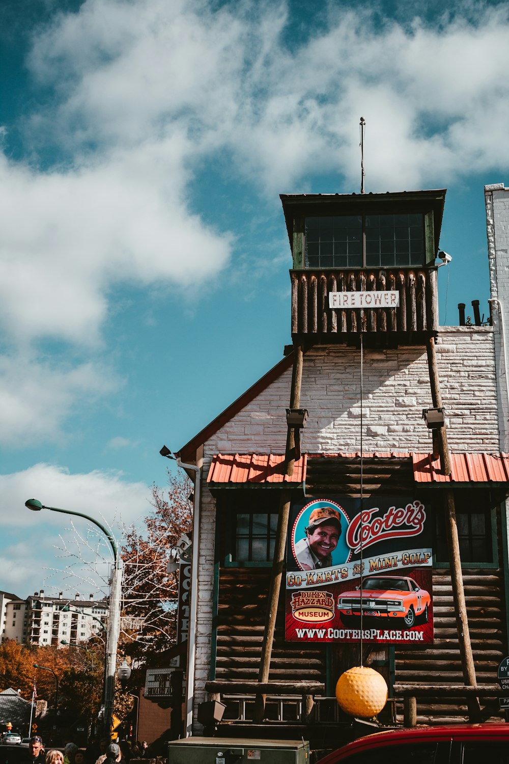 a truck parked in front of a wooden building