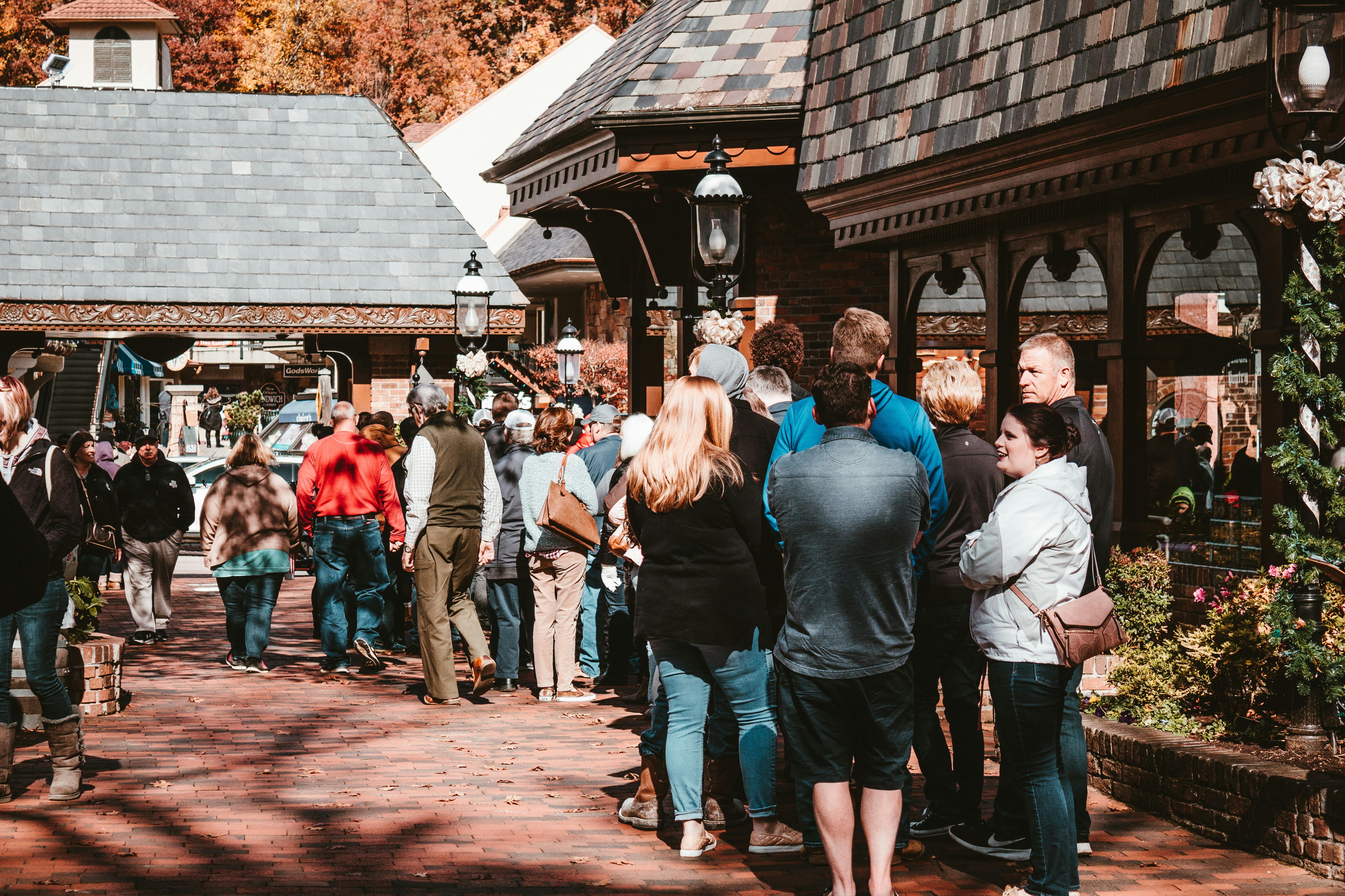 a group of people standing outside of a building