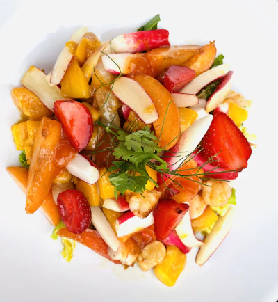 a close up of a plate of food with fruit