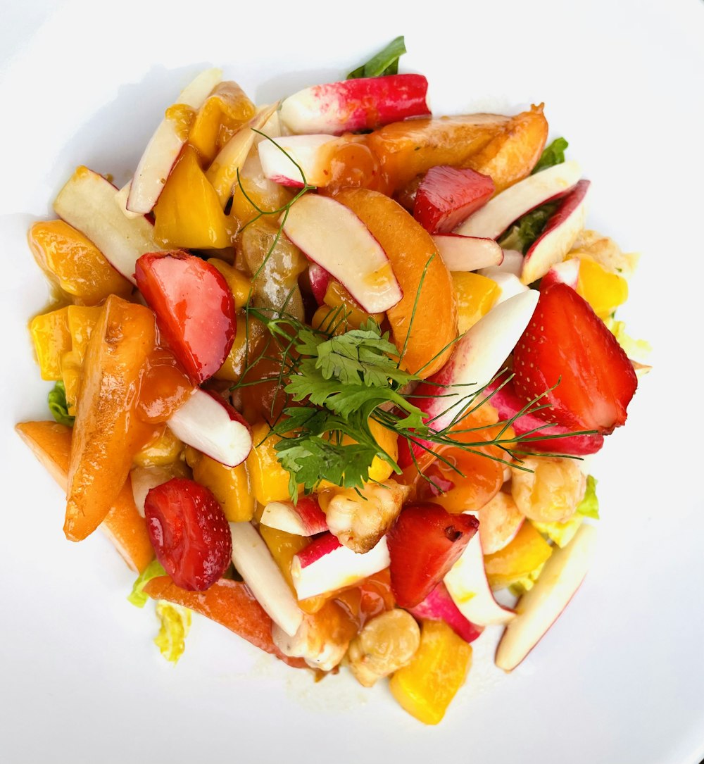 a close up of a plate of food with fruit