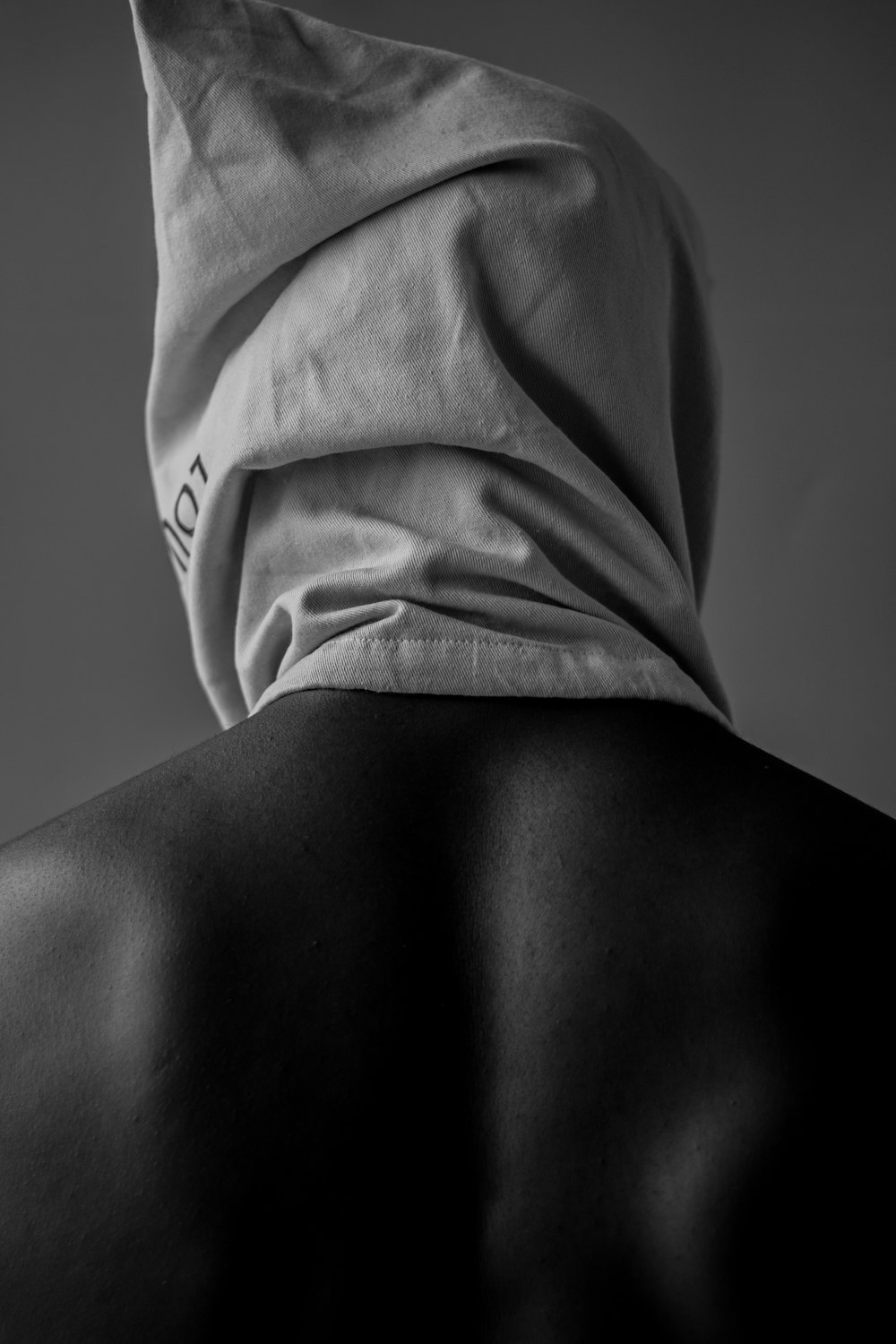 the back of a man wearing a hoodie