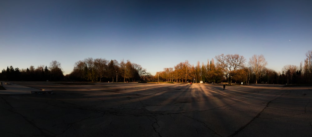 the sun is shining on the empty parking lot