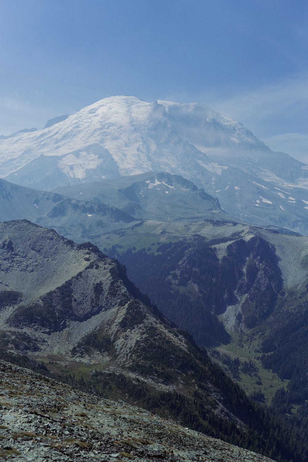 a view of a mountain range with snow on the top