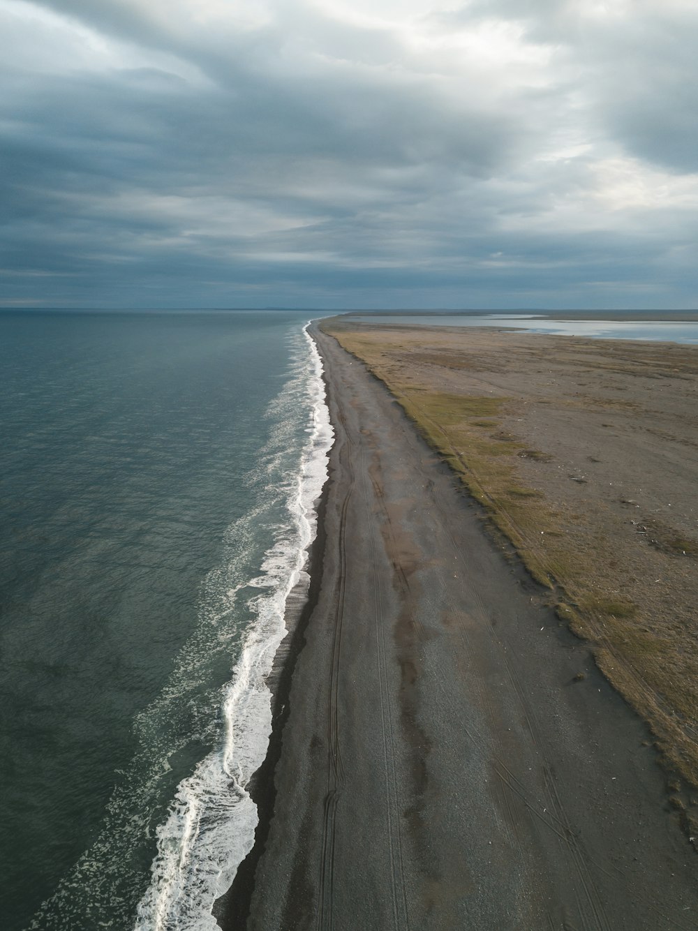 an aerial view of a beach and a body of water