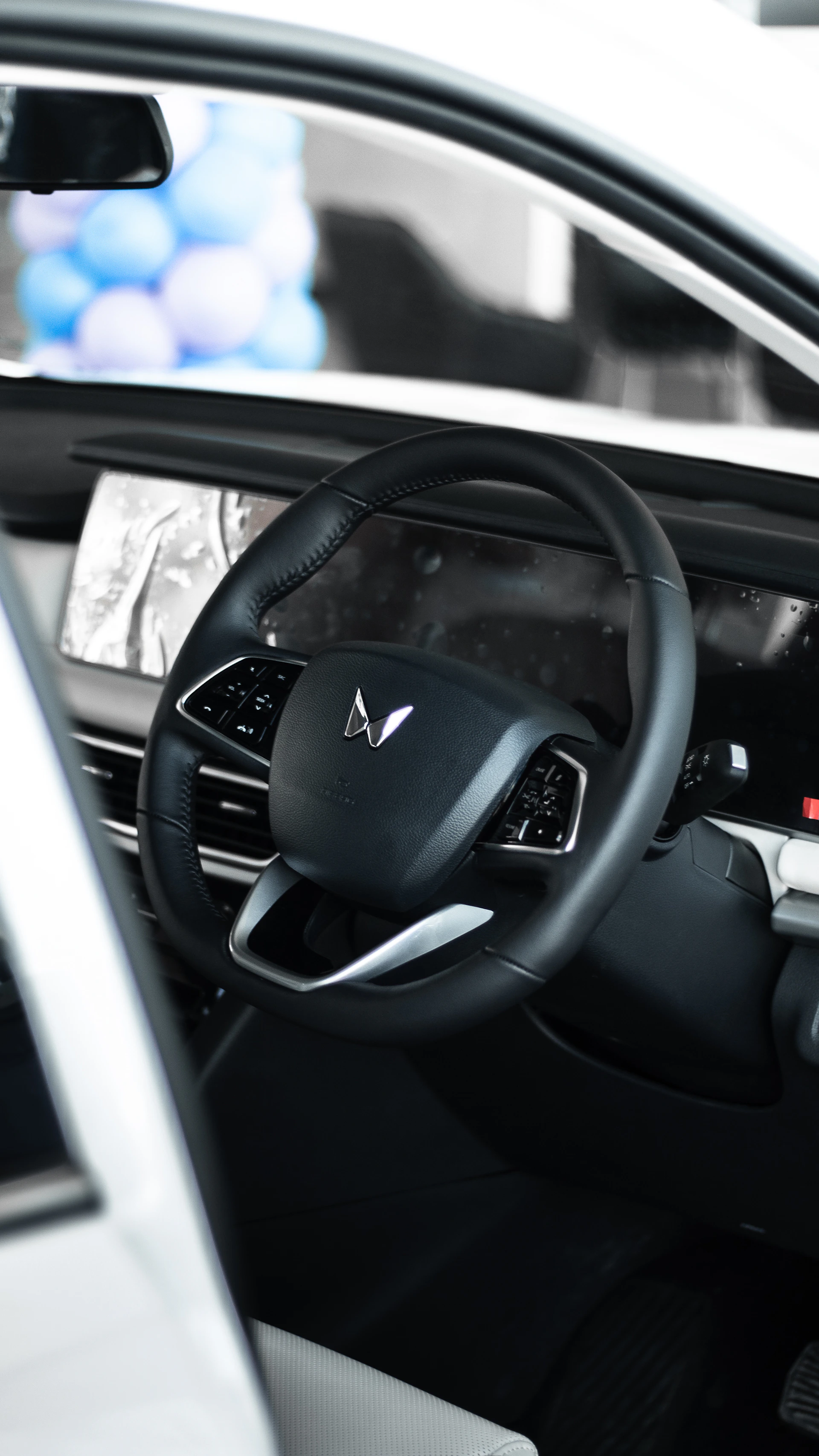 a close up of a car dashboard with a steering wheel